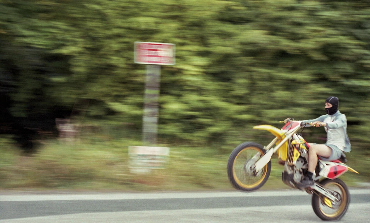 Motocross rider powering along a dirt track