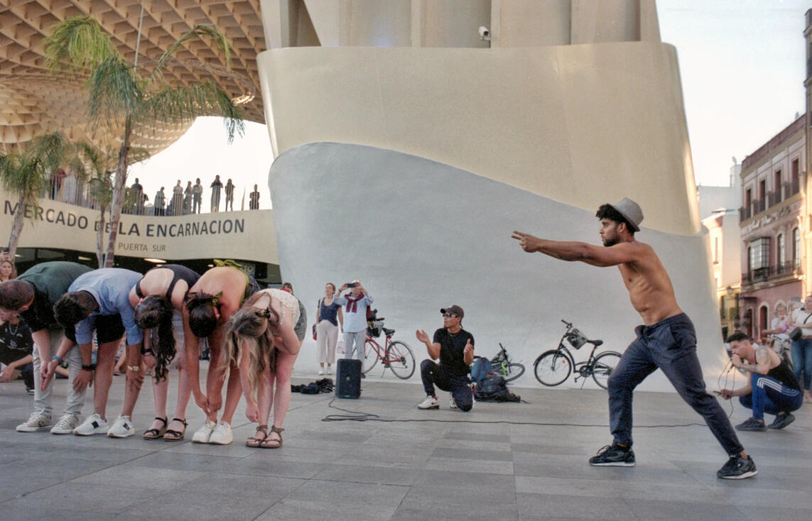 Street performers beneath the Metropol Parasol, Seville